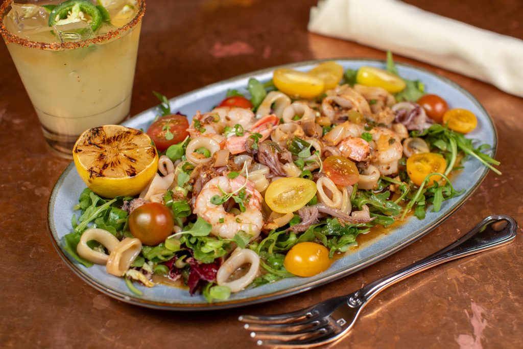 Grilled Calamari & Scampi with arugula, tomatoes, garlic espelette pepper, spicy aioli and grilled lemon.