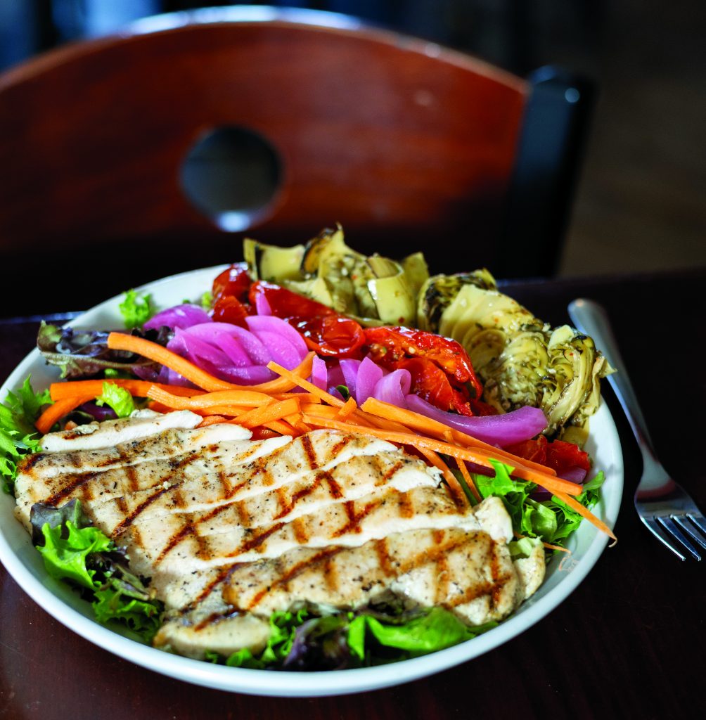 Northwood Chicken Salad with grilled chicken, mixed greens, roasted tomatoes, carrots, pickled onions and roasted artichokes.